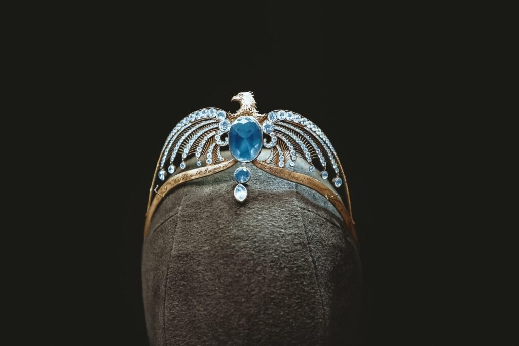 silver and blue gemstone studded crown